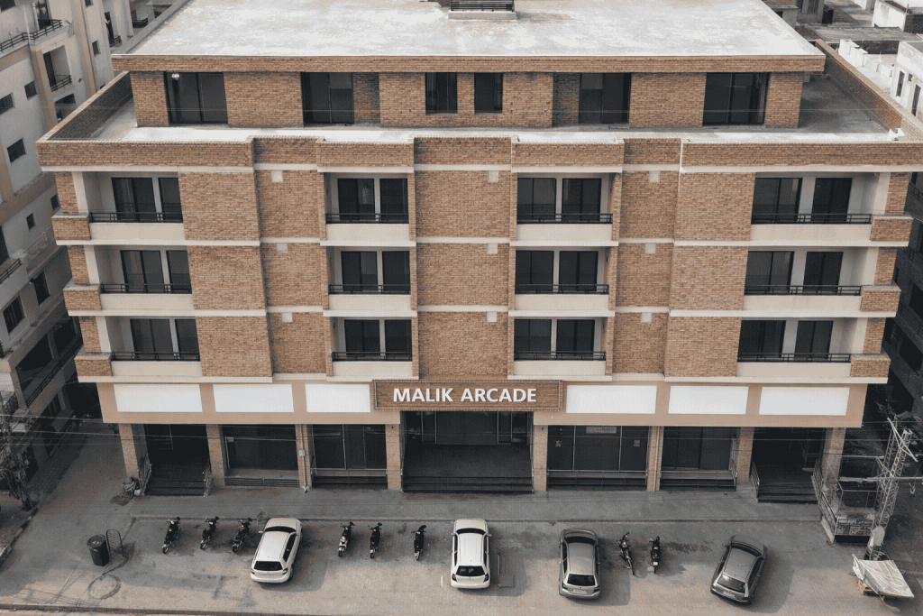 Front view of Malik Arcade plaza in Islamabad with retail shops